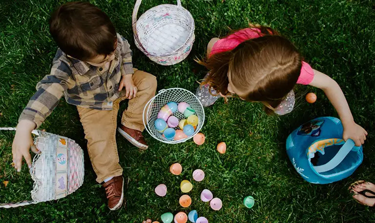 children in easter egg hunt in the garden