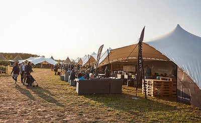 Tents on the Waitrose Summer Festival in the sunset.