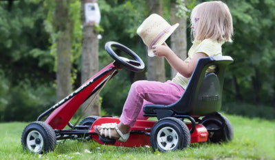 Little girl plays on Kettler Melbourne go kart