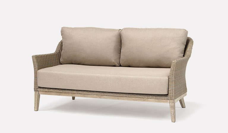 The Cora 3 Seater Sofa from KETTLER's garden furniture range on a grey background.