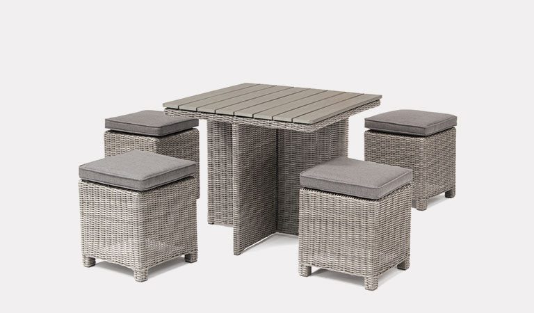 Cube Set with Dark Oak Slat Top Table in white wash from KETTLER's Casual Dining garden furniture range on a grey background.