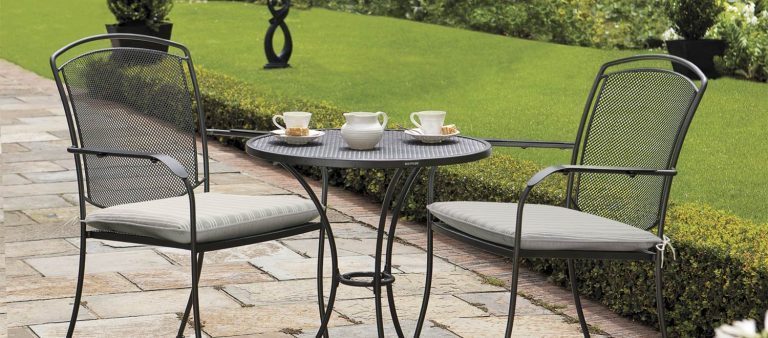 Henley Dining Set in Iron Grey with cushions from the KETTLER at John Lewis metal garden furniture range on a patio