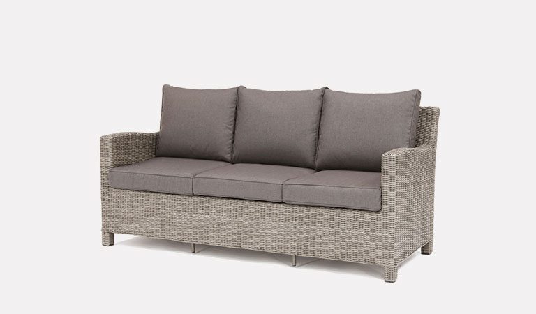 Palma 3 Seater Sofa in white wash from KETTLER's Casual Dining Garden furniture range on a grey background.