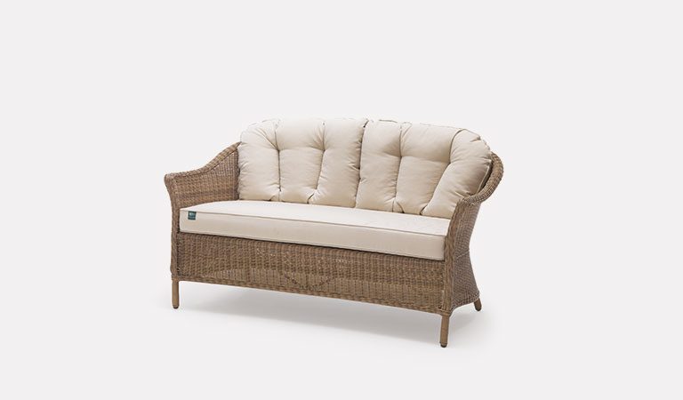 RHS Harlow Carr 2 Seater Sofa with cushions from the RHS by KETTLER garden furniture range on a grey background.