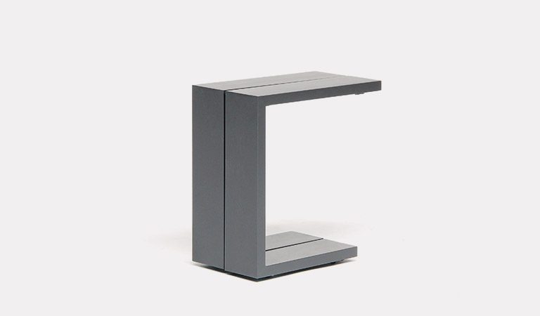 The Elba Garden furniture side table on a grey background.