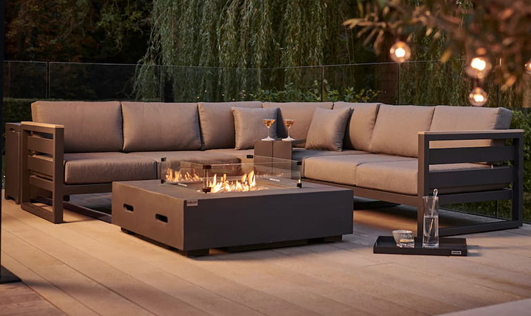 An outdoor sofa with firepit