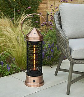 copper lantern patio heater in a garden