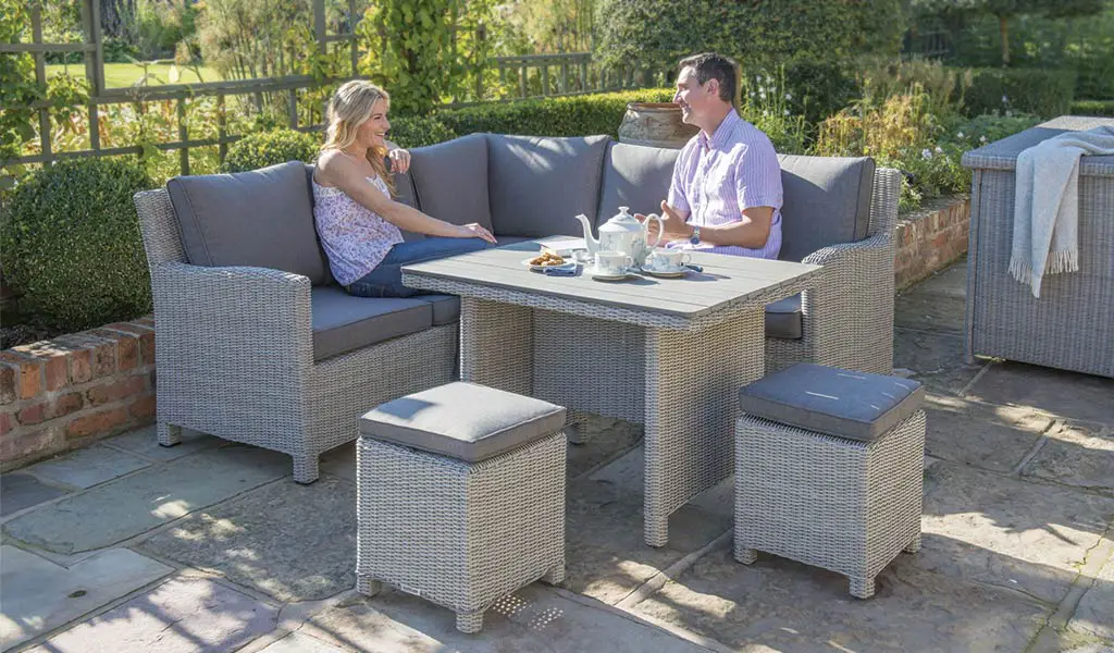 Palma Mini Set in white wash with slat top table from KETTLER's Casual Dining range on a patio.