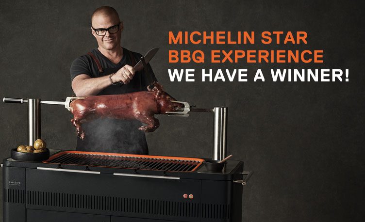 Heston cooking pig on BBQ spit.