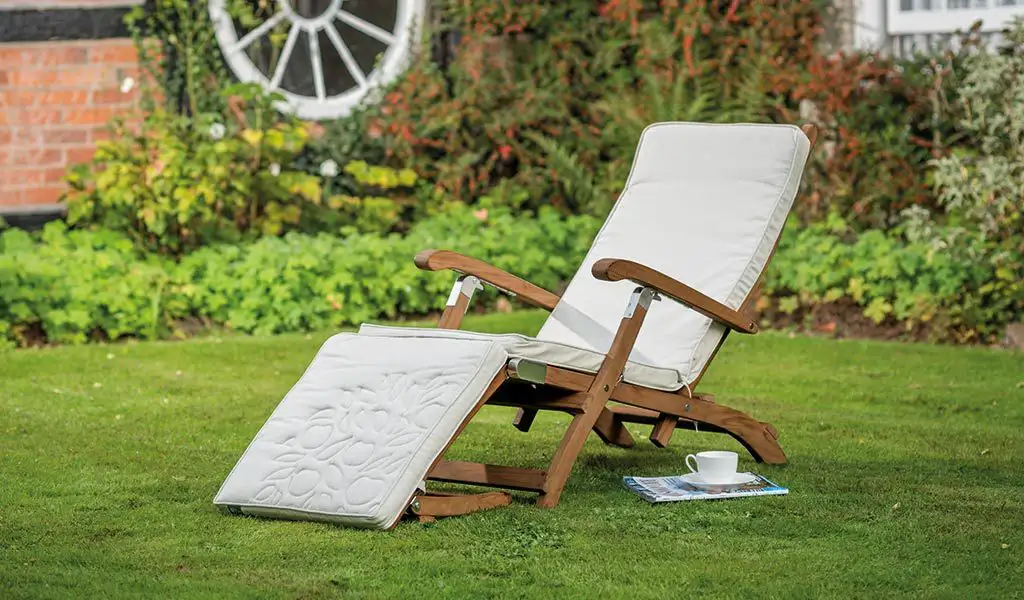 The Chelsea Steamer with Cushion from the RHS by KETTLER garden furniture range on a lawn.