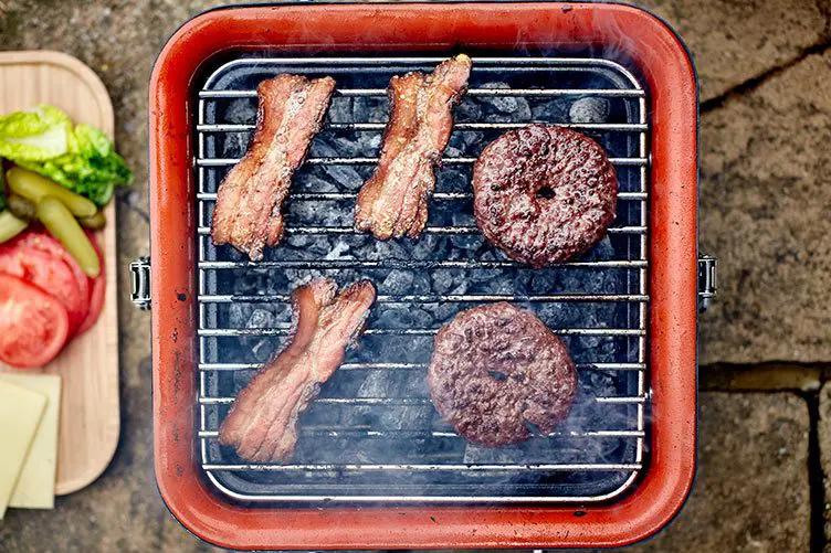 two burgers and three ribs on cube bbq