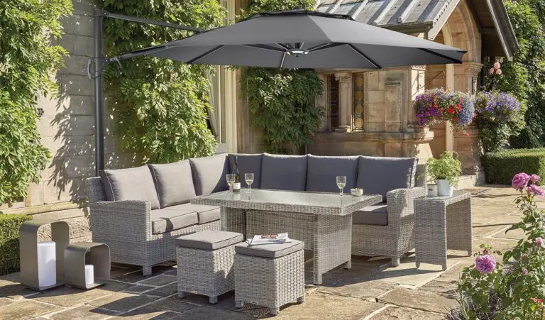 Kettler Palma Corner Set with glass top table and parasol on patio setting