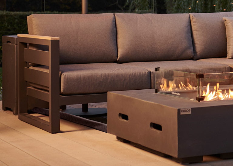 An outdoor sofa and fire pit