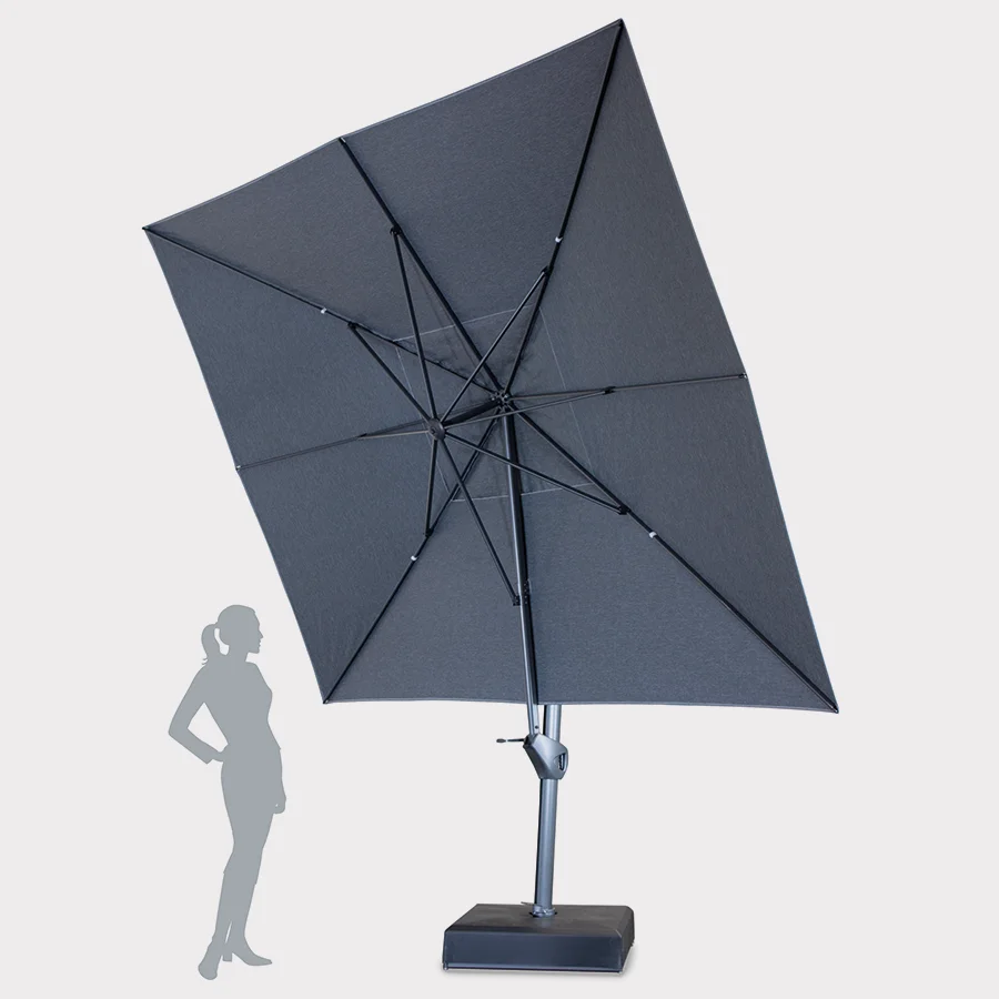Large free arm parasol tilted casting shadow over silhouette on whit background