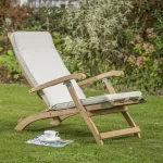 RHS Chelsea folding lounge steamer with cushion on a garden grass