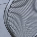 Close up detail image of Caredo chair classic metal mesh.