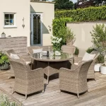 Charlbury 6 seat dining set on a garden patio in the sunshine