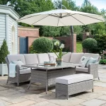Charlbury corner set on a garden patio underneath a free arm parasol in the sunshine