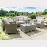 Charlbury wicker lounge set on a garden patio in the sunshine