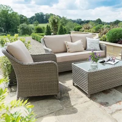 Charlbury wicker lounge set on a garden patio in the sunshine