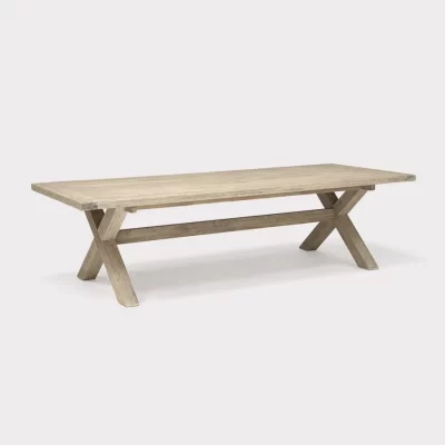 cora 280 x 110cm crossed leg wooden dining table on a plain white background