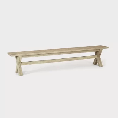 cora 230cm crossed leg wooden bench on a plain white background