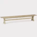 cora 270cm crossed leg wooden bench on a plain white background