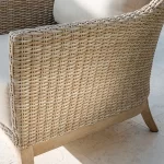 Detail image of cora wicker on an armchair in the sunshine