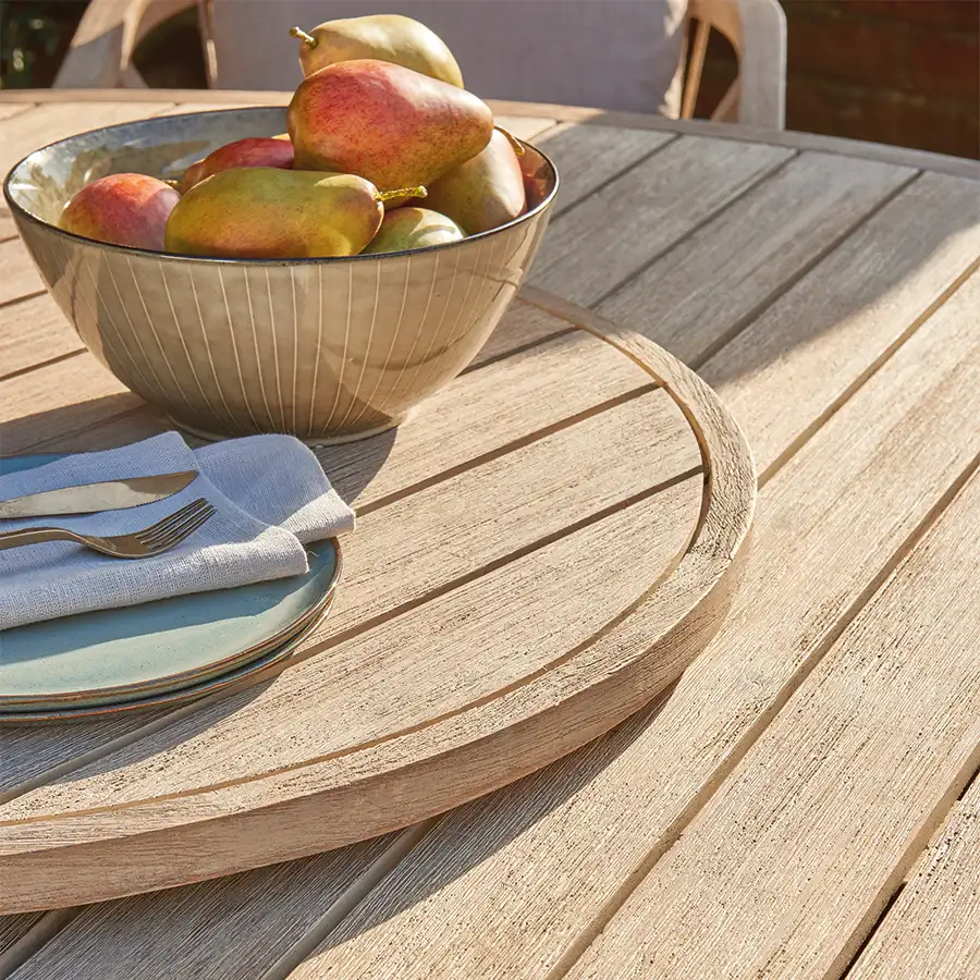 Detail image Cora 76cm lazy susan made from fsc wood on a table in the sunshine with bowl od apples