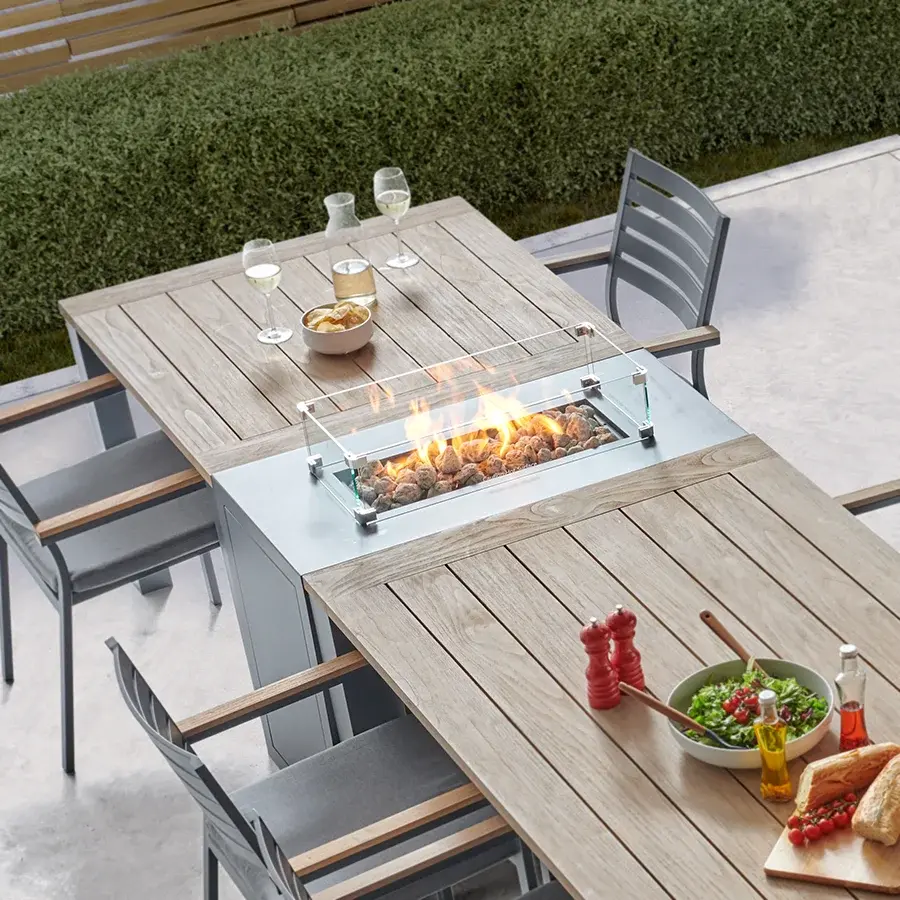 detail image of elba 6 seat dining set with elba fire pit station in grey on a plain white background