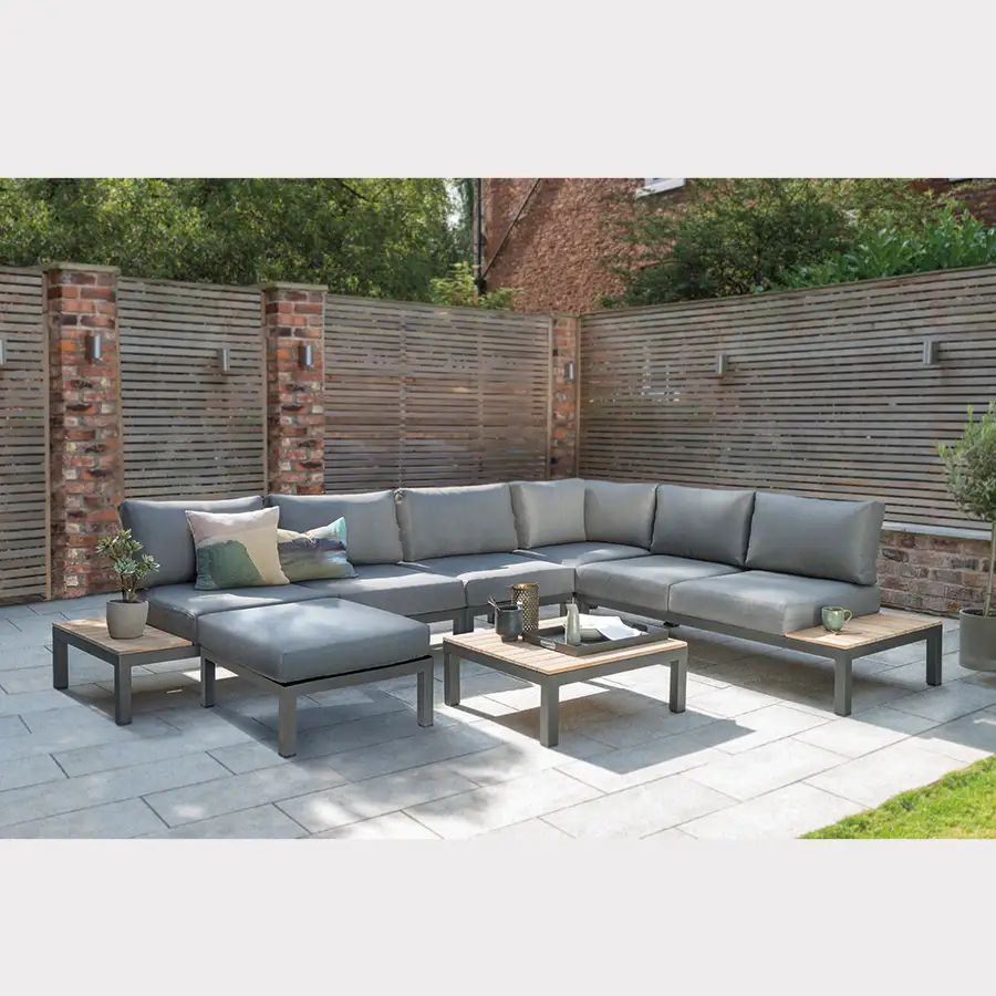 elba low lounge set with standard corner sofa and side chair in grey on modern garden terrace