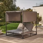 Elba day bed on a garden patio with both loungers inclined