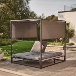 Elba day bed on a garden patio with one lounger inclined and the other reclined