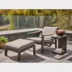 Elba relaxer and footstool in grey on garden patio in the sunshine