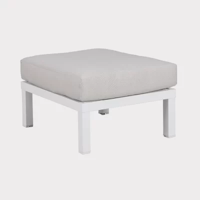 elba low lounge single foot stool in white with stone cushion on a plain white background