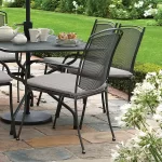 Henley armchair in iron grey with seat pad on a garden patio