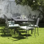 Henley 6 seat dining set on in iron grey on the grass in a garden