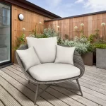 LaMode comfort chair with cushions on a courtyard decking in the sunshine