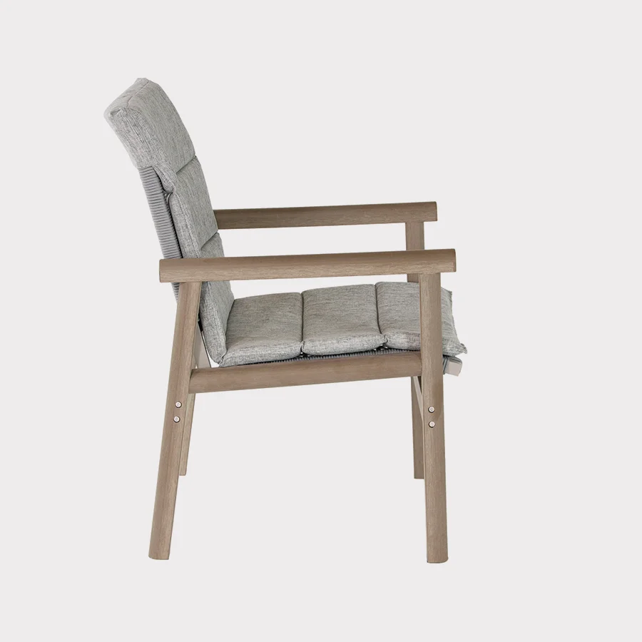 Mali dining chair side view with cushion on a plain white background