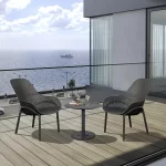 Café Modena Lounge chairs in grey on a balcony overlooking the sea