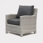 Palma armchair in white wash wicker with grey cushions on a white background