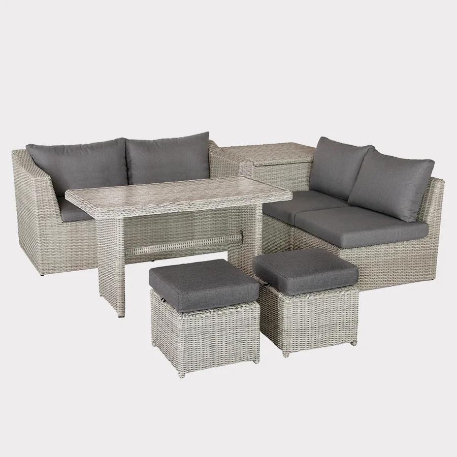 Palma compact corner set in white wash wicker with grey cushions on a plain white background