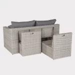 Palma compact corner sofa in white wash wicker with grey cushions shows how chairs store in the back