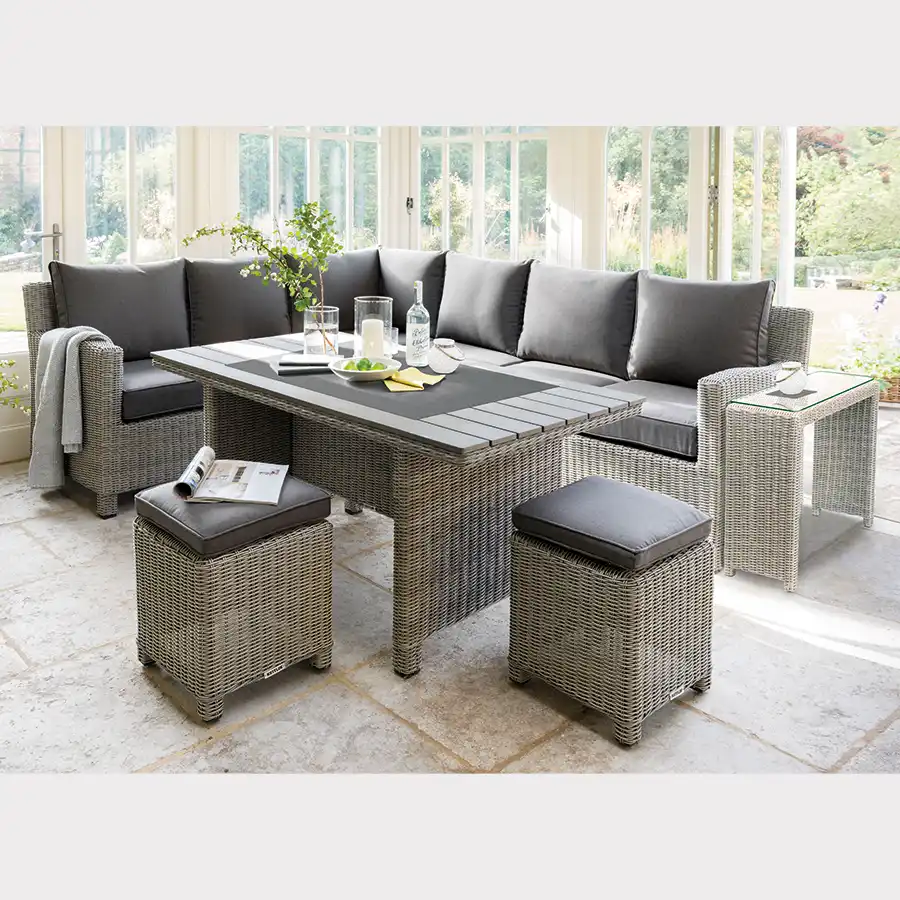 Wicker corner dinining set with table in conservatory setting
