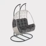 Palma double cocoon swinging seat in white wash wicker on a plain white background