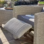 Palma Duo Relaxer set in white wash wicker with grey cushions on garden terrace in the sunshine