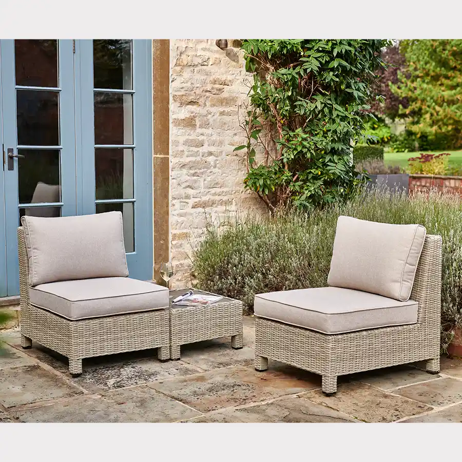 Palma Low Lounge companion set in oyster wicker with stone cushions on garden patio