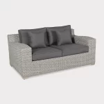 Palma luxe 2 seater sofa in white wash wicker with grey cushions on a plain white background