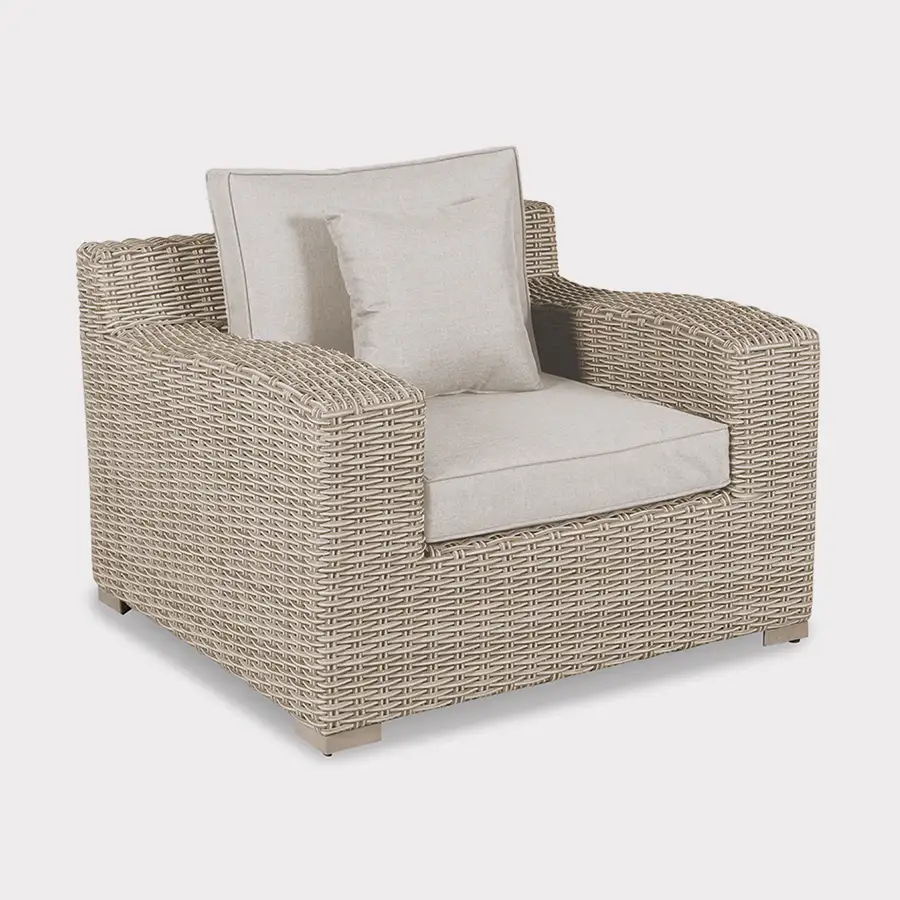 Palma luxe armchair in oyster wicker with grey cushions on a plain white background