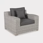 Palma luxe armchair in white wash wicker with grey cushions on a plain white background